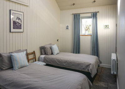 Twin beds in the Retreat Barn